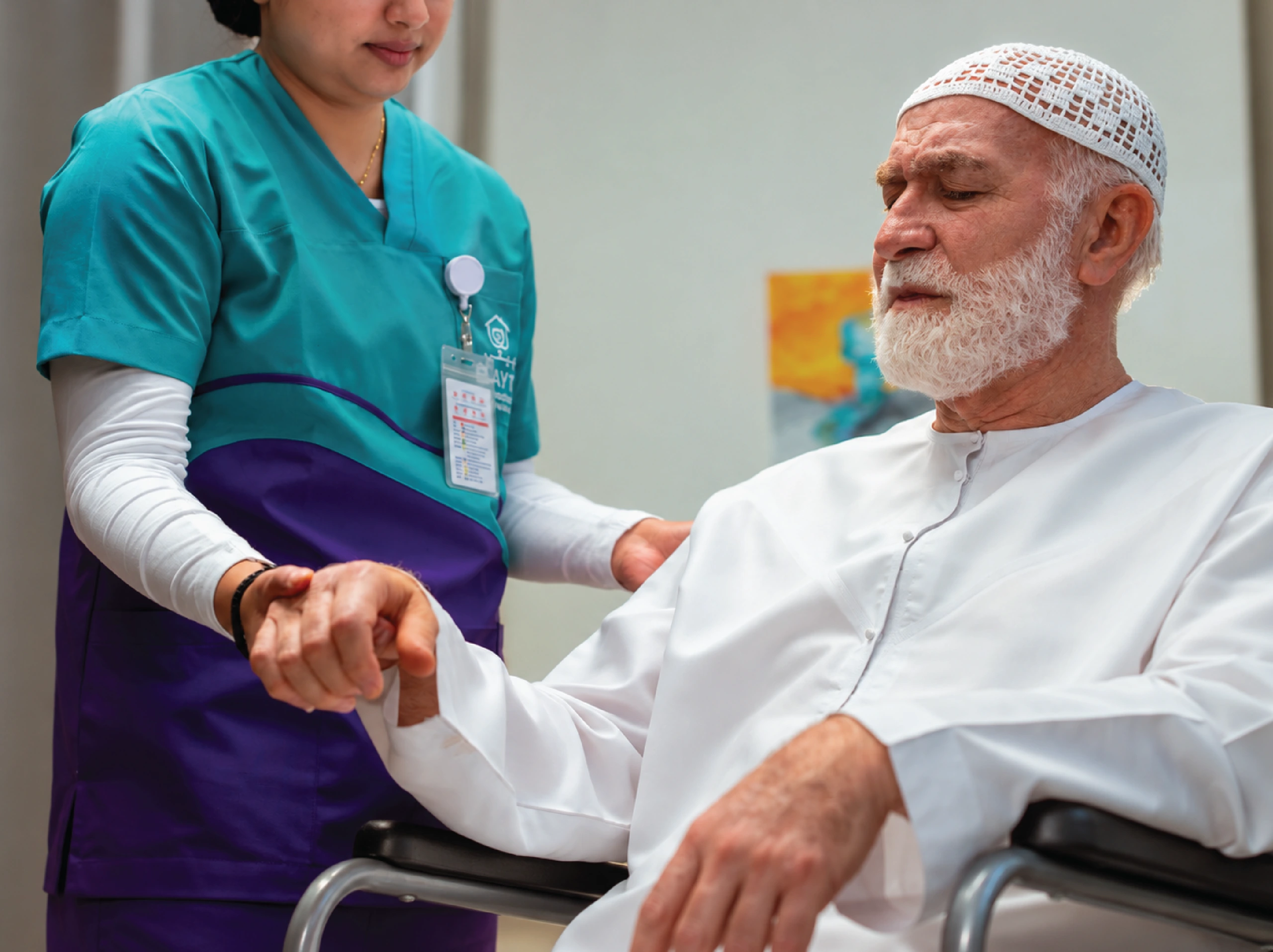 A physiotherapist standing behind an older patient holding a chair for balance